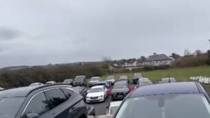 <p>A crowded car park at the rear of the hospital.</p>