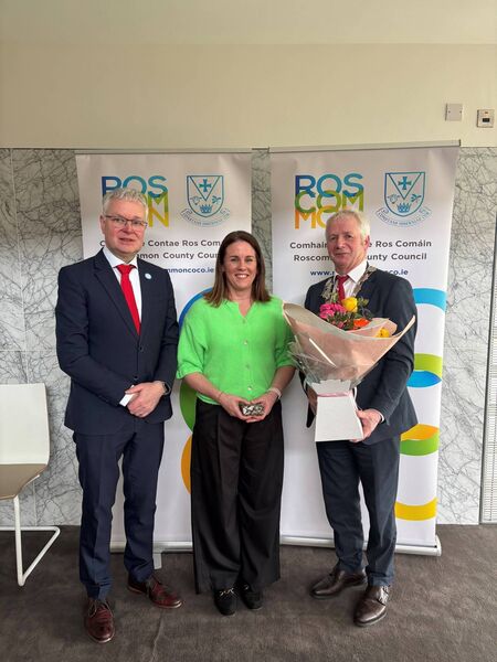 Chief executive of Roscommon County Council Shane Tiernan and Cathaoirleach Liam Callaghan make a presentation to Paula Earley. Chief executive of Roscommon County Council Shane Tiernan and Cathaoirleach Liam Callaghan make a presentation to Paula Earley.