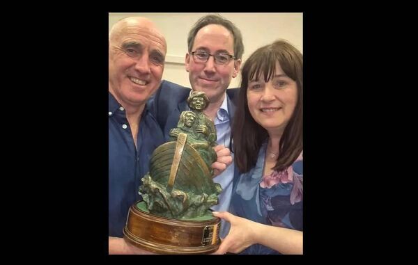 Coman Keaveny, Paraic Newman and Marie Coneran with the winning trophy.
