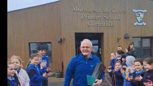 <p>Postman Tommy O'Brien with a guard of honour.</p>
