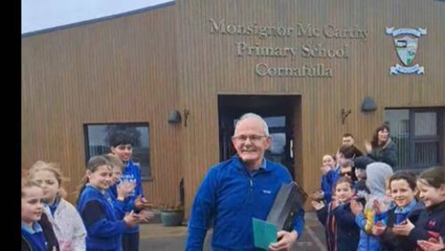 <p>Postman Tommy O'Brien with a guard of honour.</p>