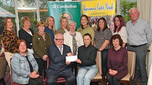 <p>Roscommon Comhaltas were the overall winners at Roscommon Easter Parade. Picture shows Larry Brennan, chairperson Roscommon Easter Parade Committee, presenting a cheque for first prize to Lorraine Kenny at the Abbey Hotel. Also in picture are, from front, left: Karen Feerick, and Patricia Morris. Back: Paula Pierse, Anna May Doolan, Marie Doorly, Linda McGarry, Louise King, Pat Pierse, Hazel Murray, Sinéad Healy, Edwina Farmer and parade secretary J.J. Cattigan. Pic: Gerard O’Loughlin</p>