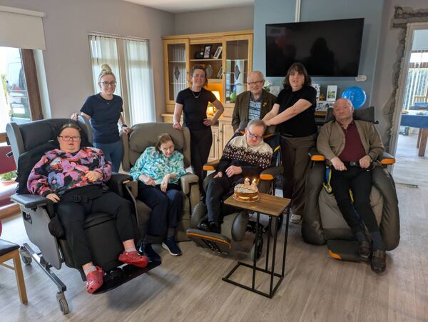 Staff and residents at Henley House, Ballinlough with Danny Burke and John Kennedy on the occasion of John's 65th birthday. Pic: Liam Reynolds 