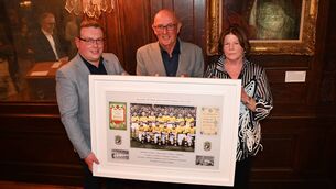 <p>Thomas Murray, chairperson Roscommon GAA, making a presentation of the 1944 All-Ireland winning team to Tom and Mary Hunt. Pic: Nuala Purcell</p>