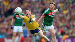 <p>Former Roscommon defender Seán McDermott, tries to grab possession ahead of Mayo's Jason Doherty during the 2017 All-Ireland Senior Football Championship quarter-final between the sides in Croke Park. Picture: INPHO/James Crombie</p>
