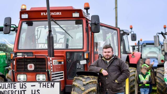 <p>Young Castlerea farmer and contractor Owen Hester pictured previously in Athlone at a protest over the Mercosur deal. Pic: Swarber Photography </p>