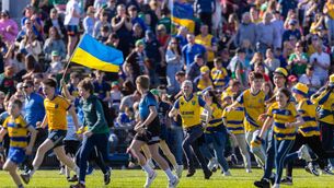 <p>ROSSIE INVASION: Roscommon supporters, young and old, invade the pitch in the aftermath of their side's stunning ten-point victory against Mayo at Hastings Insurance MacHale Park, Castlebar, on Sunday afternoon. Picture: INPHO/Tom O’Hanlon</p>