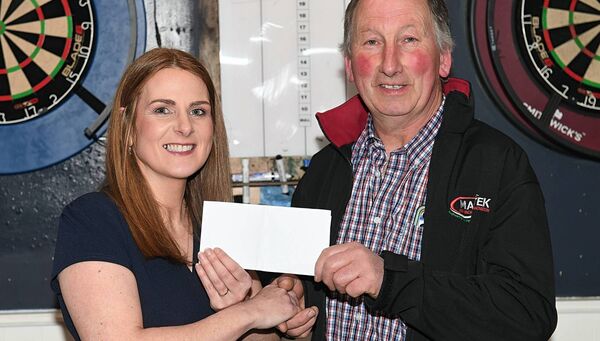 Maurice Gannon, main sponsor, presenting a sponsorship cheque to ploughing treasurer Martina Beirne at the launch of the 2026 Roscommon Ploughing Championships. Pic:Gerard O'Loughlin
