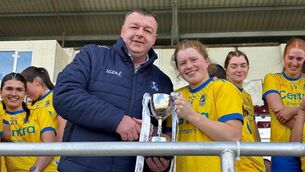 <p>Roscommon minor ladies' football captain, Shauna McGrath, receives the cup to confirm her side as Connacht LGFA Minor A champions on Monday evening. Picture: Roscommon LGFA</p>