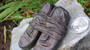 <p>The bronze shoes along the Famine Way.</p> <p>The bronze shoes along the Famine Way.</p>