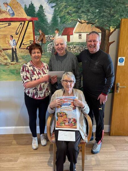 Anne and Tommy Feeney making a presentation to Joe Keane on his retirement from O'Connor's Bar &amp; Shop in Ballinlough recently. Joe visits his life long friend Nellie Keaveney (sitting in front) at the Ava Maria Nursing Home, Toreen every week. Wishing Joe years of health and happiness. 