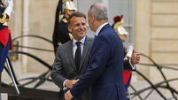 Taoiseach greeted by French president on arrival for talks in Paris