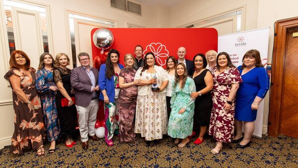 Connacht Caregiver of the Year, Mary Foley (centre), celebrates her award win with the Dovida Sligo, Leitrim, and Roscommon team.