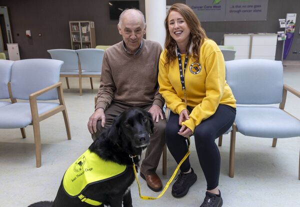 Gerard McCabe from Derrnasoo, Carrick-on-Shannon, County Roscommon pictured with Áine Ní Fhlaithearta and Irish Therapy Dog Khai at the Radiation Oncology Centre, University Hospital Galway.