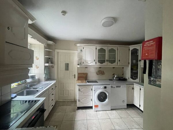 The property comes with an adjoining five-bedroom townhouse.