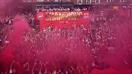 Arsenal put Champions League defeat behind them with open-top bus parade