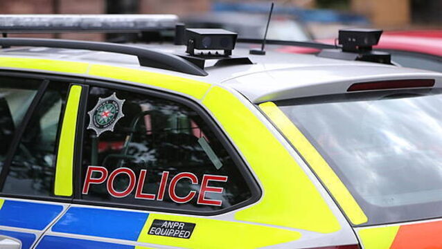 Man held on suspicion of attempted murder after police car driven at officer