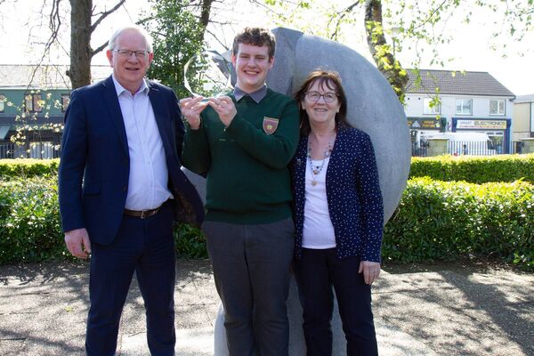 President of TUS, Professor Vincent Cunnane, and the founder and CEO of Scifest, Sheila Porter, congratulate Ronan after he won the Scifest TUS Athlone competition. 