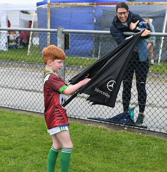 Tadhg McDermott, Castlerea, getting to grips with an umbrella during the damp conditions at the Community Games athletics finals in Ballyleague. Pic: Gerard O'Loughlin Tadhg McDermott, Castlerea, getting to grips with an umbrella during the damp conditions at the Community Games athletics finals in Ballyleague. Pic: Gerard O'Loughlin