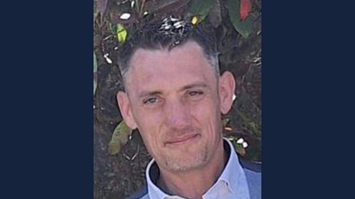 Two men accused of murder seen throwing golf clubs over a wall