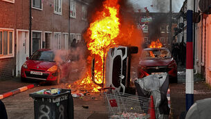 <p>Vehicles set on fire by protesters on Lendrick Street in Belfast, as disorder flared in response to a stabbing attack in the city. Pic: Press Association</p>