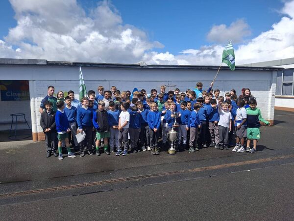 Members of Castlerea Celtic winning men’s and ladies’ teams on a visit to St. Paul’s NS with the silverware won recently.