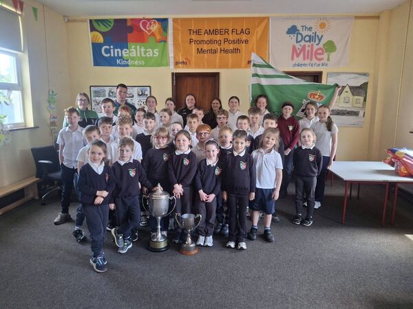 Members of Castlerea Celtic winning men’s and ladies’ teams on a visit to Threen NS with the silverware won recently.