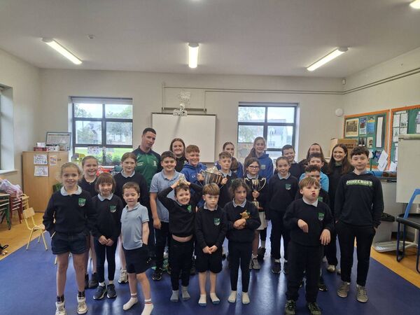 Members of Castlerea Celtic winning men’s and ladies’ teams on a visit to Cloonbonniffe NS with the silverware won recently.
