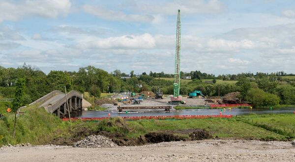 Site works continue for the new bridge over the River Shannon at Hartley outside Carrick-on-Shannon. The view is from the Roscommon bank, with the existing bridge seen on the left. That bridge, dating to 1915 and an early example of reinforced concrete bridge construction, is due for eventual demolition. Pic: Gerry Faughnan Site works continue for the new bridge over the River Shannon at Hartley outside Carrick-on-Shannon. The view is from the Roscommon bank, with the existing bridge seen on the left. That bridge, dating to 1915 and an early example of reinforced concrete bridge construction, is due for eventual demolition. Pic: Gerry Faughnan