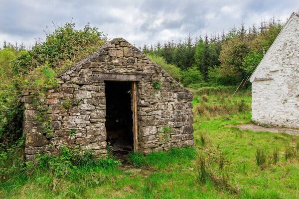 To the left of the entrance sits a traditional stone-built outhouse. To the left of the entrance sits a traditional stone-built outhouse.