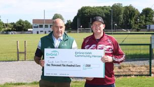 <p>Aidan Naughton, EirGrid Liaison Officer with Cathal McCormack of Tulsk Lord Edwards GAA Club the Connacht regional runner-up of The EirGrid GAA Community Heroes competition. Photo: XPOSURE.ie </p>