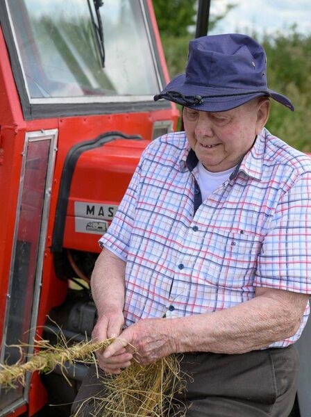 Making the hay rope, or súgán, using long stems of hay twisted together by hand. Pic: Breda Durr Making the hay rope, or súgán, using long stems of hay twisted together by hand. Pic: Breda Durr