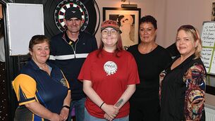 <p>Martha McKeon, Elphin, with Eugene Connolly, Hannah Victory, Shirley Dempsey and Arlene Connolly, Leitrim darts team, pictured at a fundraiser for Hannah in the Hollywood Bar, Roscommon last weekend. Pic: Gerard O’Loughlin</p>