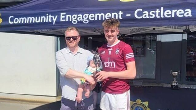 <p>The ‘Player of the Match’ trophy was presented by Sergeant Kelly’s son, Daniel, and his grandson Jack, to Callum Gavican</p>