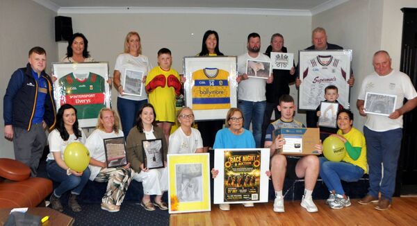 Organisers with some of the valuable items to be auctioned during a fundraiser for Mayo Roscommon Hospice Foundation and Cloonfad United FC, which takes place on Saturday, July 25th. Pic: Liam Reynolds