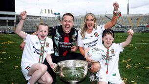 <p>Mayo senior football manager, Ballaghaderreen man Andy Moran, with his wife Jennifer, daughter Charlotte and son Ollie, and the Sam Maguire Cup, in the aftermath of his side's famous All-Ireland Senior Football Championship final victory on Sunday last. Picture: INPHO/Tom Maher</p>