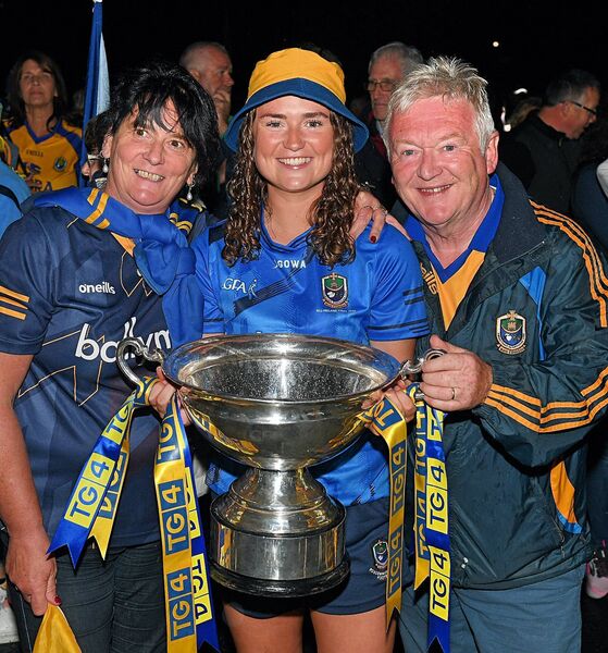 Aisling Hanly with her parents celebrating after the All-Ireland winning Roscommon intermediate ladies team arrived back in Roscommon with the Mary Quinn Cup. Pic Gerard O’Loughlin Aisling Hanly with her parents celebrating after the All-Ireland winning Roscommon intermediate ladies team arrived back in Roscommon with the Mary Quinn Cup. Pic Gerard O’Loughlin