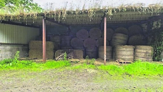 To the rear of the residence is a three-bay hay shed with lean-to cubicle shed. To the rear of the residence is a three-bay hay shed with lean-to cubicle shed.