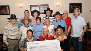 <p>A fundraiser event for the Irish Heart Foundation was held in early July in Glinsk in memory of the late Michael Tiernan. Picture shows Marcella Gemmell, patient service co-ordinator Ireland West (centre), accepting a cheque in the sum of €17,025.86 from event organisers Marie Tiernan and Aisling Fitzmaurice in Dowd’s of Glinsk. Full picture, left-to-right, front: Marie Tiernan, Marcella Gemmell and Aisling Fitzmaurice. Centre row, from left: Larry Tierney, Jane Sypher, Rachel Thompson, Jackie Sharkey, Seán T. Kelly and Brian Neilan. Back row, from left: Alita Neilan, Bernie Kelly, John Griffin and Dolores Dowd. Pic: Gerard O’Loughlin </p>