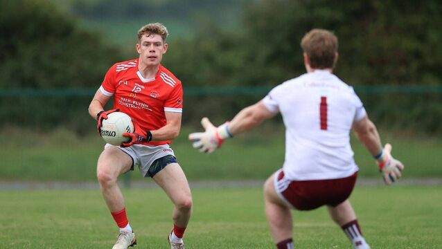 <p>Keelan Kelly is faced by Boyle goalkeeper, Seán Garavan, during his side's comfortable senior football championship victory in Strokestown on Friday evening. Picture: Bernie O'Farrell</p>