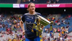 <p>Roscommon captain Helena Cummins with the Mary Quinn Memorial Cup following her side's victory against Fermanagh in Croke Park. Picture: INPHO/Grace Halton</p>