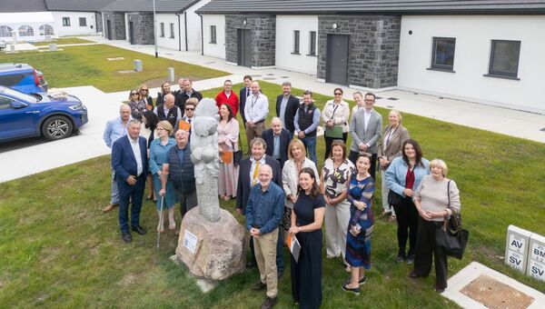 Guests gather beside the newly unveiled sculpture at the official opening of six new age friendly homes in Castlerea. Guests gather beside the newly unveiled sculpture at the official opening of six new age friendly homes in Castlerea.