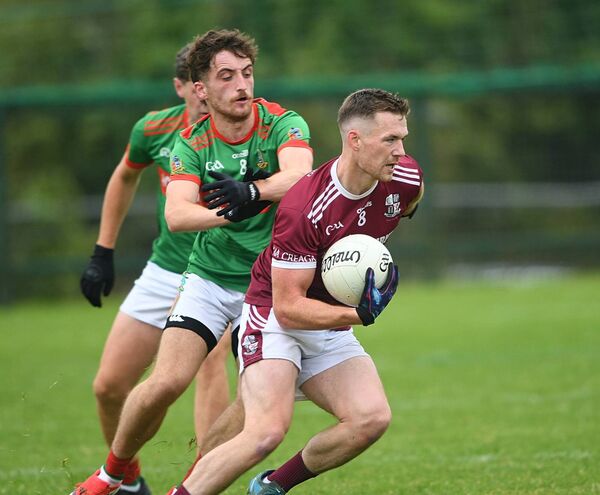 Creggs midfielder Shane Dowd turns away from his St. Michael's counterpart, Niall Sheerin, during Sunday's intermediate football championship match at Enfield. Picture: Gerard O'Loughlin Creggs midfielder Shane Dowd turns away from his St. Michael's counterpart, Niall Sheerin, during Sunday's intermediate football championship match at Enfield. Picture: Gerard O'Loughlin