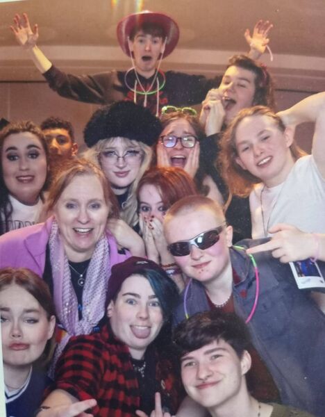 Joanna pictured with members of the LGBTQ+ youth group in 2024.