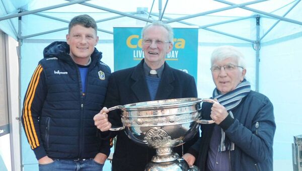 Conor Cox, Roscommon footballer with Canon Gerry Hanly and Tony Conboy back in 2019. 