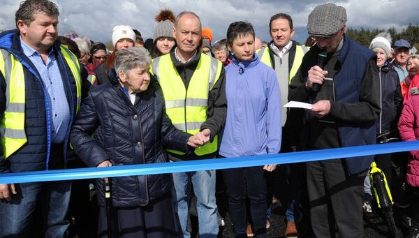 Canon Gerry Hanly and Patsy Carty pictured cutting the tape at the start of a the walk around Cavetown Lake  back in 2022 organised by the Carty family, in memory of the late Sr. Mary Carty.