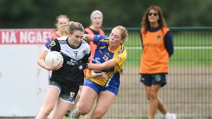 <p>Éire Óg defender, Katelyn Doory, tries to escape from the clutches of Clann na nGael's Roisín O'Brien during Sunday's senior ladies' football championship game at Johnstown. Picture: Gerard O'Loughlin</p> <p>Éire Óg defender, Katelyn Doory, tries to escape from the clutches of Clann na nGael's Roisín O'Brien during Sunday's senior ladies' football championship game at Johnstown. Picture: Gerard O'Loughlin</p>