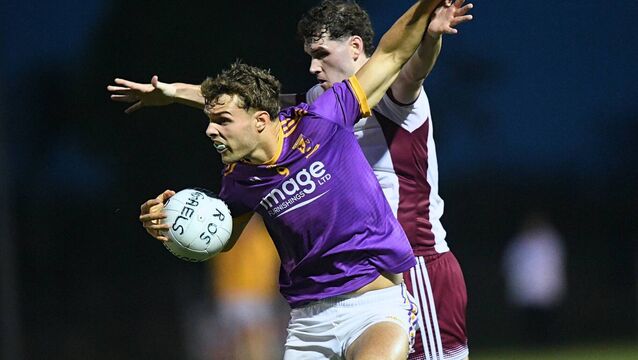 <p>Rory Carthy holds off the challenge of Boyle's Niall O'Donnell during Friday evening's senior football championship game at Lisnamult. Picture: Gerard O'Loughlin</p>