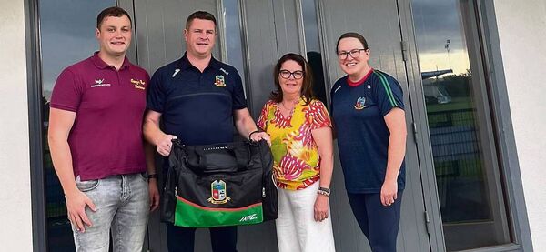 Michael and Ann McGonigle presenting a set of kitbags, sponsored by Clancy's Bar, to Stephen McGuinness and Clare Noone, St. Michael's GAA Club, to mark Clancy's 150th year in business. Michael and Ann McGonigle presenting a set of kitbags, sponsored by Clancy's Bar, to Stephen McGuinness and Clare Noone, St. Michael's GAA Club, to mark Clancy's 150th year in business.
