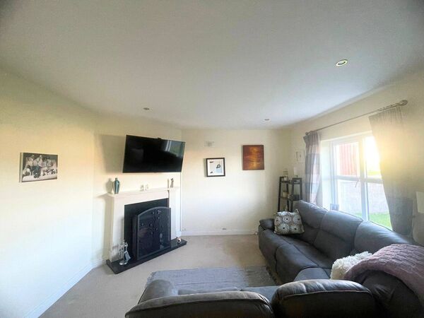 The living room is a good size and overlooks the garden. The living room is a good size and overlooks the garden.